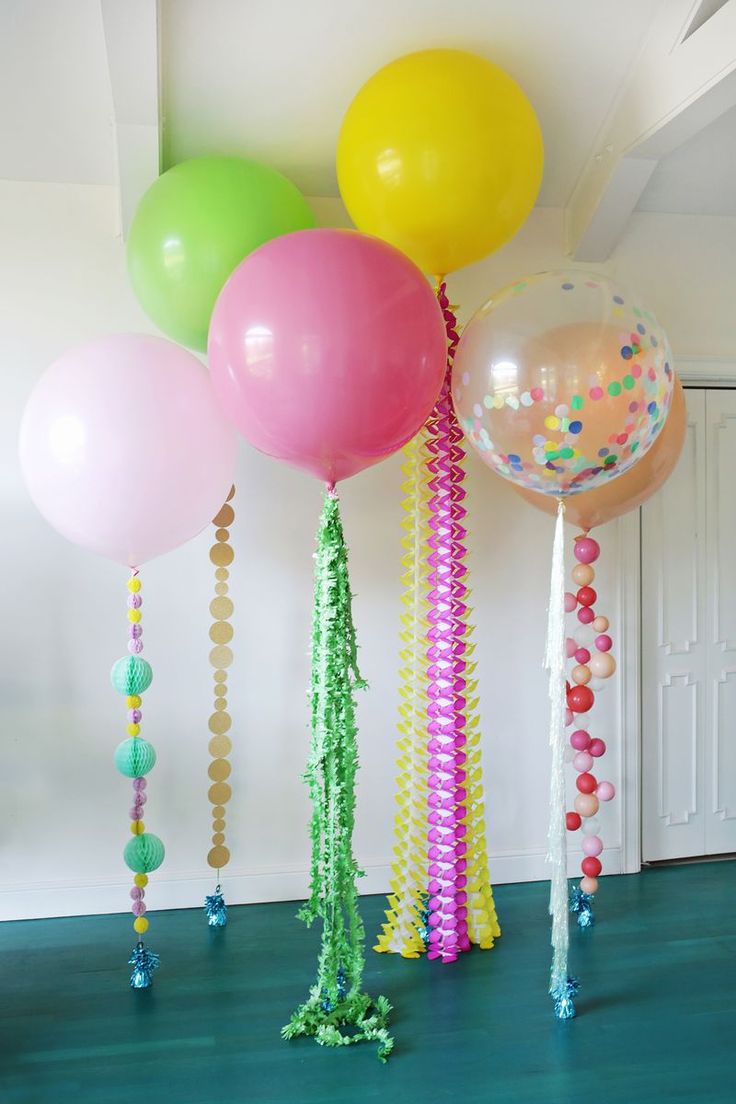 balloons and streamers are hanging from the ceiling