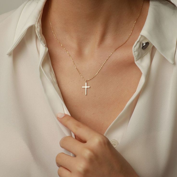 Showcase your faith with our Cross Pendant Necklace. The perfect gift for confirmation, christening, or any special occasion. Made for women who want to make a statement of their belief in a stylish and elegant way. Get one for yourself or a loved one today! Pendant width: 10 Millimeters; Pendant height: 16 Millimeters Please note that we also offer matching Cross Bracelet in our shop! Elegant Crucifix Cross Necklace, Elegant Rose Gold Sterling Silver Cross Necklace, Elegant Cross Necklace With Delicate Chain For Gift, Elegant Crucifix Jewelry With Delicate Chain, White 14k Gold Cross Necklace Gift, White 14k Gold Cross Necklace As Gift, 14k Gold White Cross Necklace As Gift, Rose Gold 14k Cross Necklace Gift, Elegant Personalized Cross Pendant Jewelry