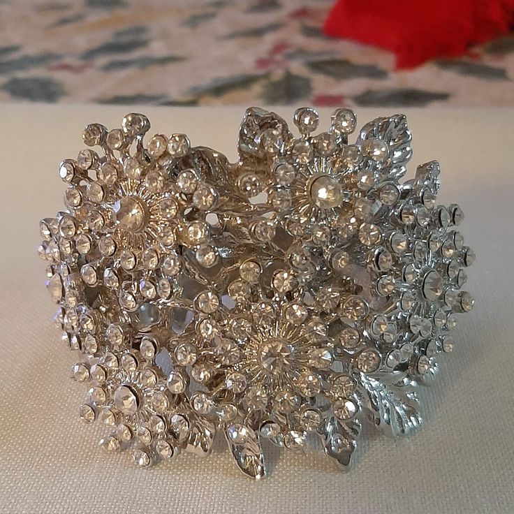 The Bracelet Is A Wide Cuff Bracelet With A Henge. The Width Is 3"S , Height Is 2 And 1/4"S. The Bracelet Is Brand New, Never Used. The Rhinestones Are Complete, Not Missing Rhinestones. No Wear, Excellent Condition. Glamorous Silver Jeweled Crystal Bracelet, Crystal Cuff Bracelet For Weddings, Silver Bedazzled Jewelry As Gift, Silver Bedazzled Jewelry Gift, Silver Bedazzled Jewelry For Gift, Adjustable Silver Bedazzled Jewelry, Adjustable Bedazzled Formal Jewelry, Adjustable Jeweled Silver Cuff Bracelet, Adjustable Crystal Bangle For Party