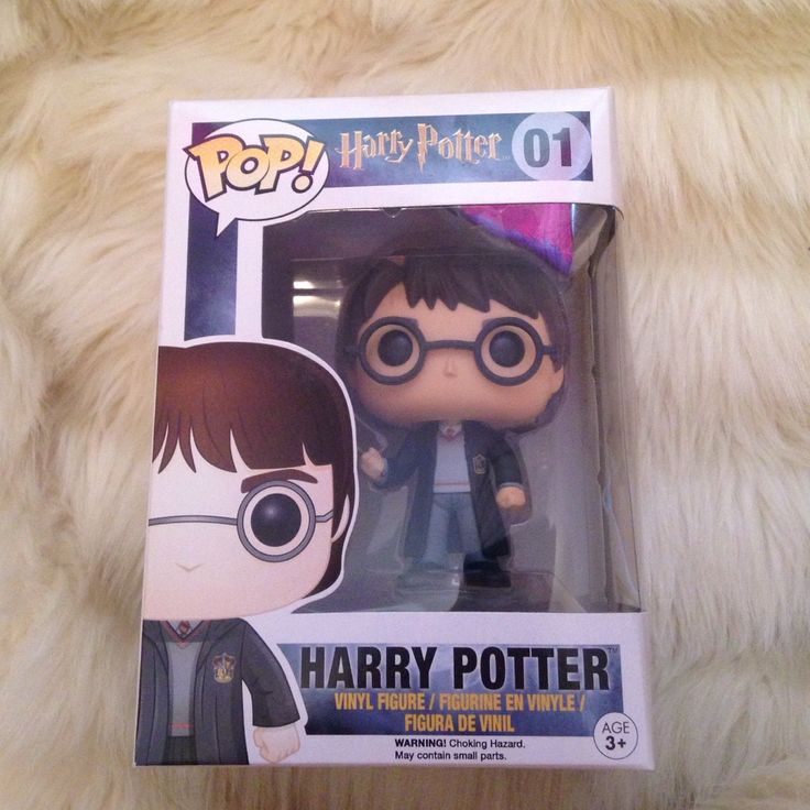 the harry potter pop vinyl figure is in its box on top of a fur rug