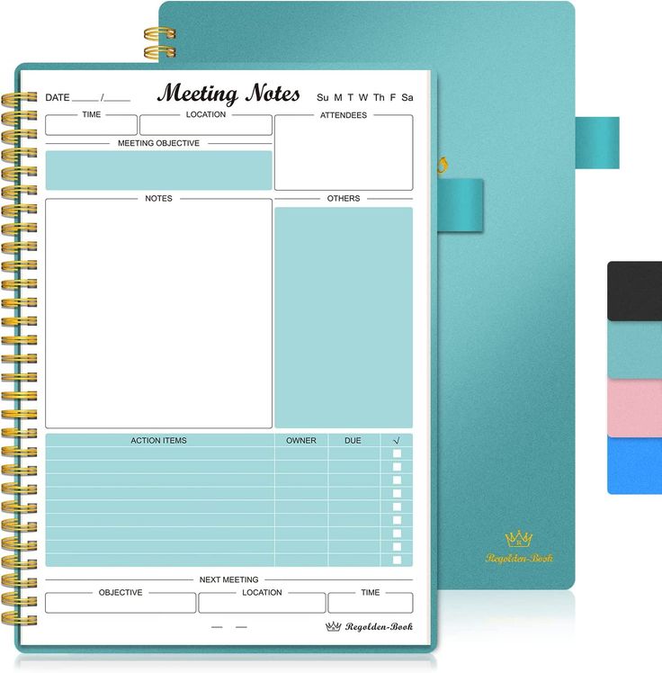 a blue planner with notes attached to it and a notepad next to the page