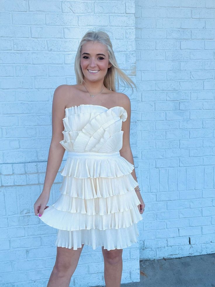 Cream Layered Pleated Ruffle Mini Dress- Bachelorette, dress, dresses & rompers, flowy dress, GRADUATION, GRADUATION DRESS, layered dress, mini dress, Pref dress, recruitment, ruched dress, RUFFLED DRESS, RUSH, Sale, tiered dress, wedding, WHITE GRADUATION DRESS-Ace of Grace Women's Boutique Fitted Pleated Tiered Mini Dress, Elegant Cream Ruffle Dress For Spring, Elegant Layered Hem Dress For Brunch, Elegant Brunch Dress With Layered Hem, Elegant Dresses With Layered Hem For Brunch, Feminine Cream Tiered Dress, Elegant Mini-length Tiered Dress With Ruffle Hem, Elegant Beige Ruffle Dress For Spring, Feminine Cream Dress With Ruffled Skirt