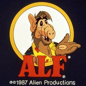 the logo for alf with an image of a cartoon character holding his hand out