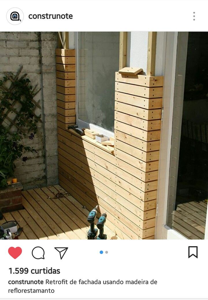 an image of a wooden deck with a window in the middle and small toy figures on it