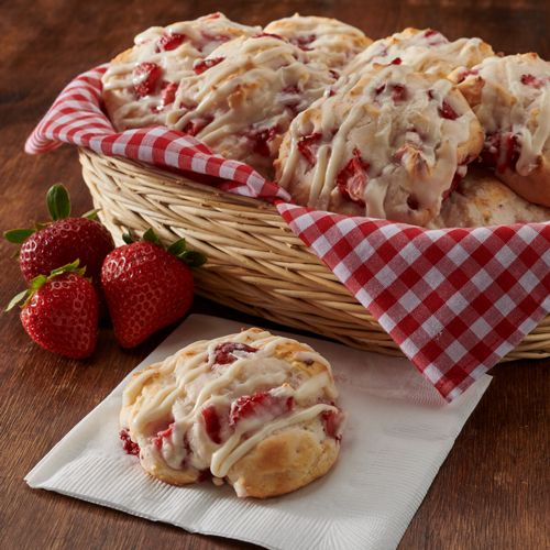 strawberry scones and strawberries in a basket on a table