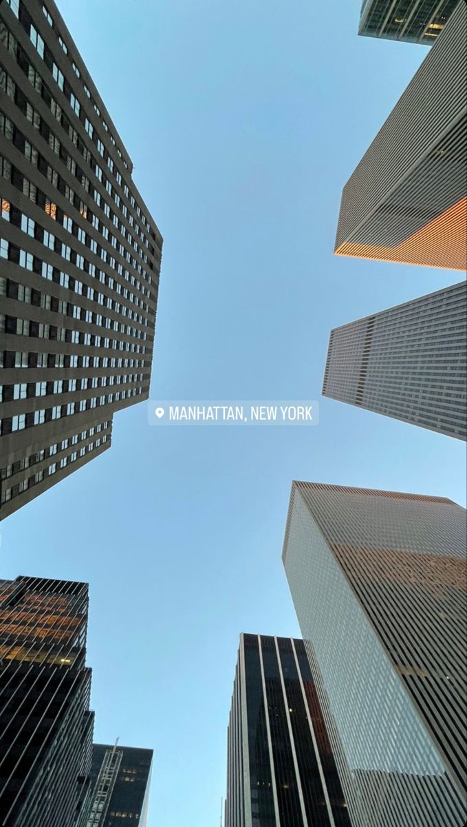 looking up at skyscrapers in manhattan, new york