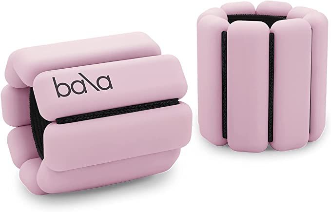 two pink plastic objects with the word bad written on one side and another type of device in the other