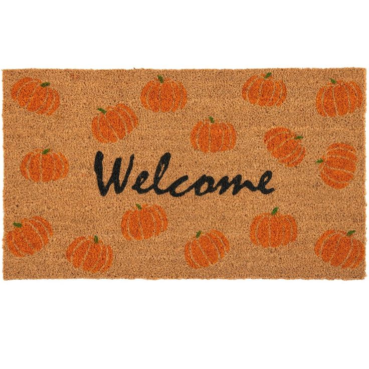 a welcome mat with pumpkins on it