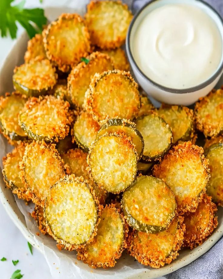 fried zucchini chips with ranch dip on the side