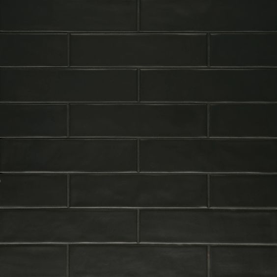 a black brick wall with white trim