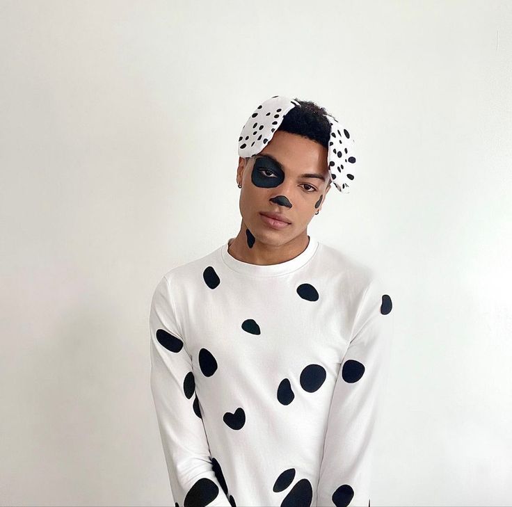 a man in a dalmatian sweater and polka dot headband