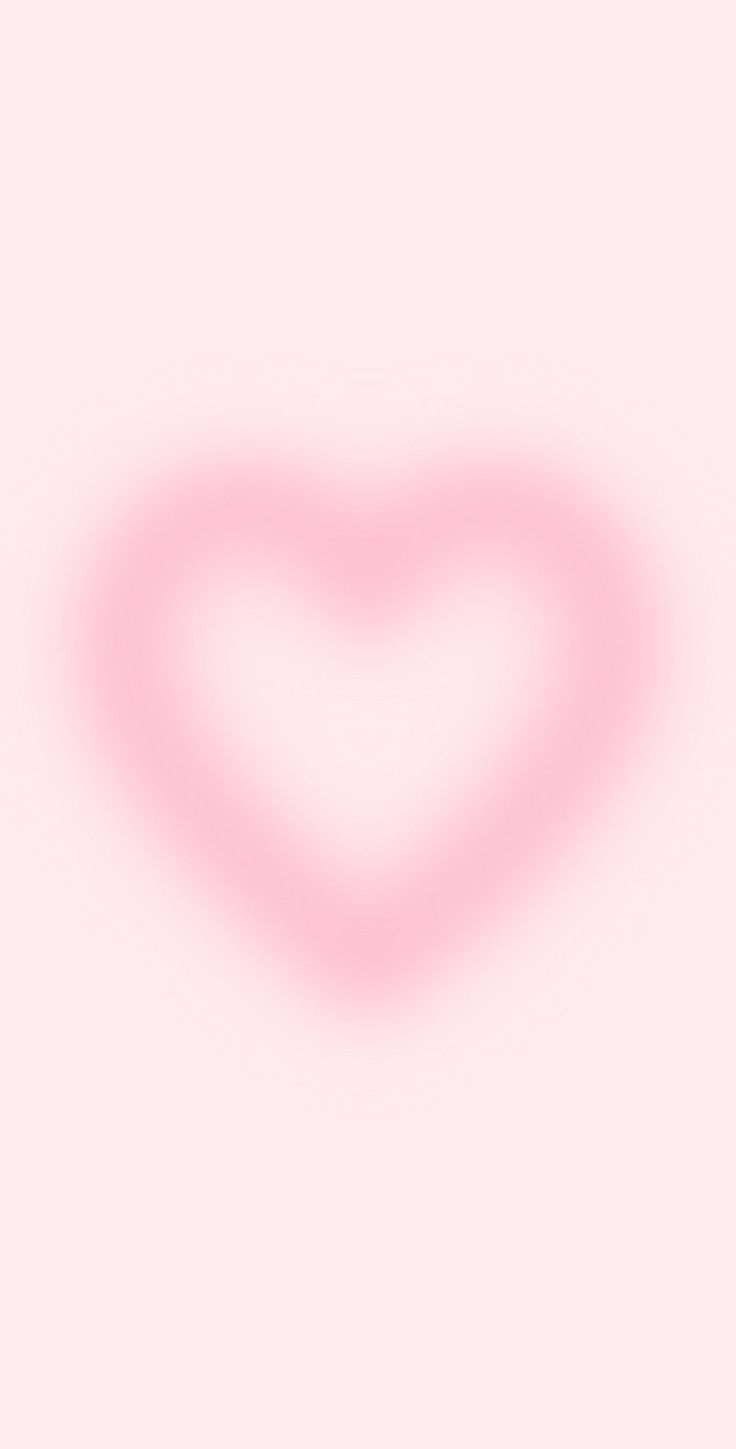 a heart shaped object on a pink background