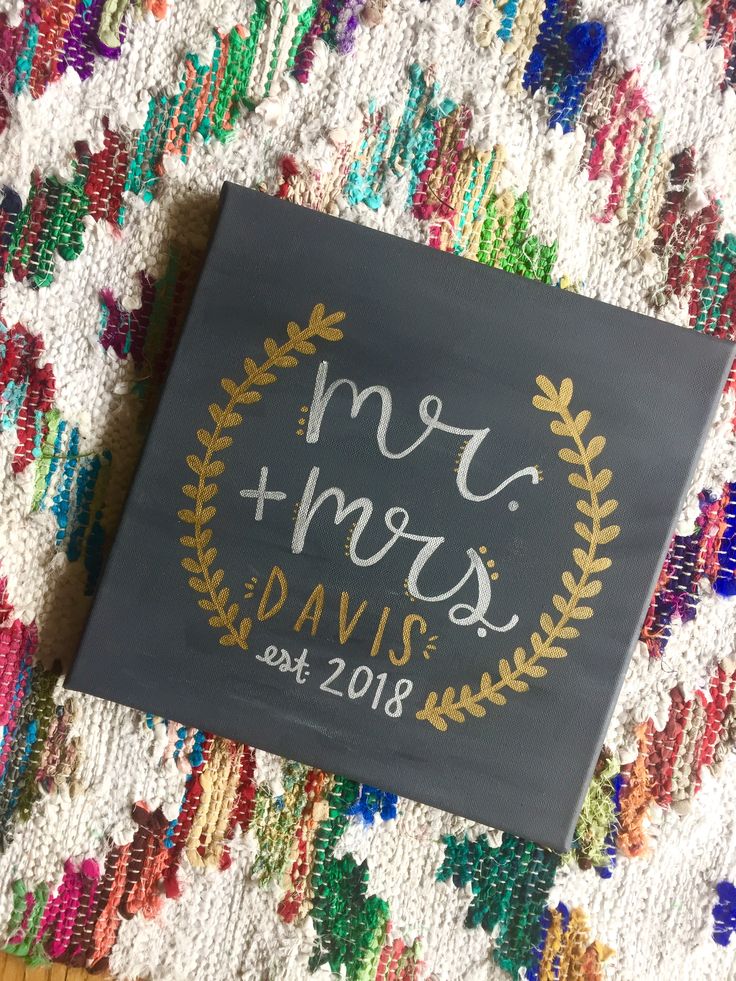 a black and gold wedding guest book with mr and mrs written on it