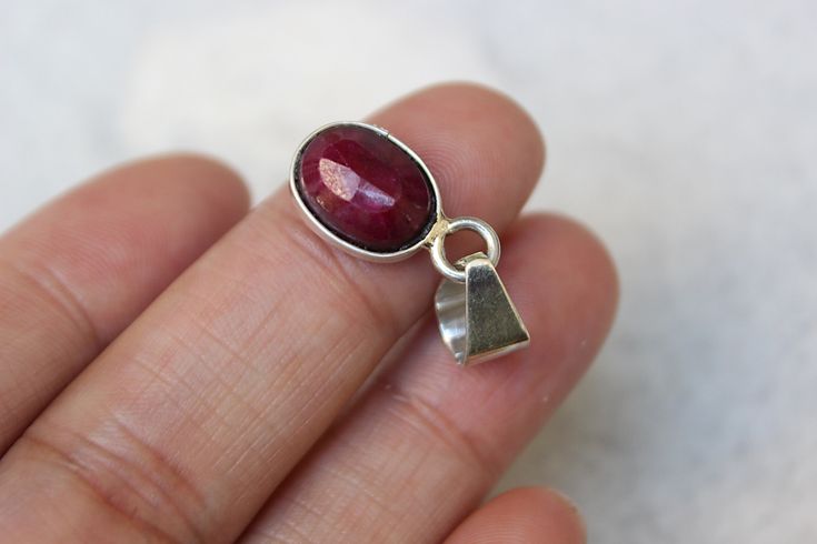 A simple, rare and one of a kind handcrafted pendant showcasing a beautiful red Ruby. All handmade with Sterling Silver .925. The pendant is approximately 19mm L X 10mm W. Handmade Red Oval Cabochon Jewelry, Red Sterling Silver Oval Cabochon Jewelry, Handmade Ruby Round Pendant Jewelry, Gift Ruby Jewelry Oval Cabochon, Red Oval Pendant Jewelry With Polished Finish, Untreated Red Sterling Silver Jewelry, Star Ruby, Purple Labradorite, Lemon Quartz