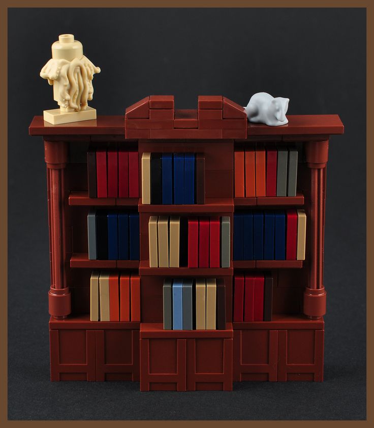 a red bookcase with books and a white cat statue on top, against a black background