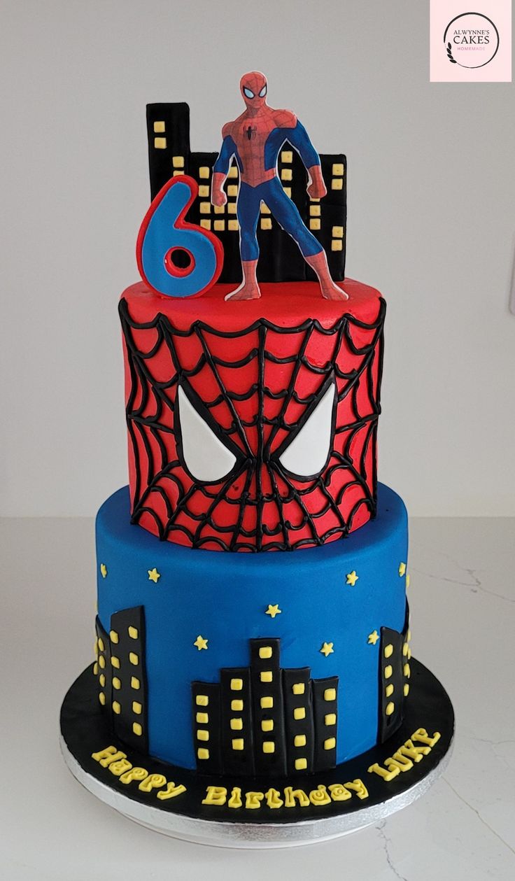 a spiderman birthday cake with the number six on it