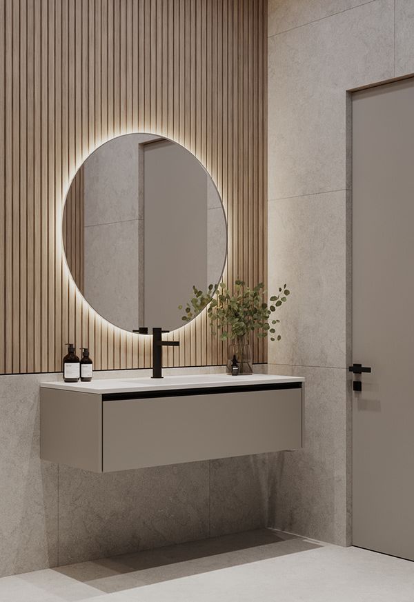 a bathroom with a sink, mirror and vase on the counter in front of it