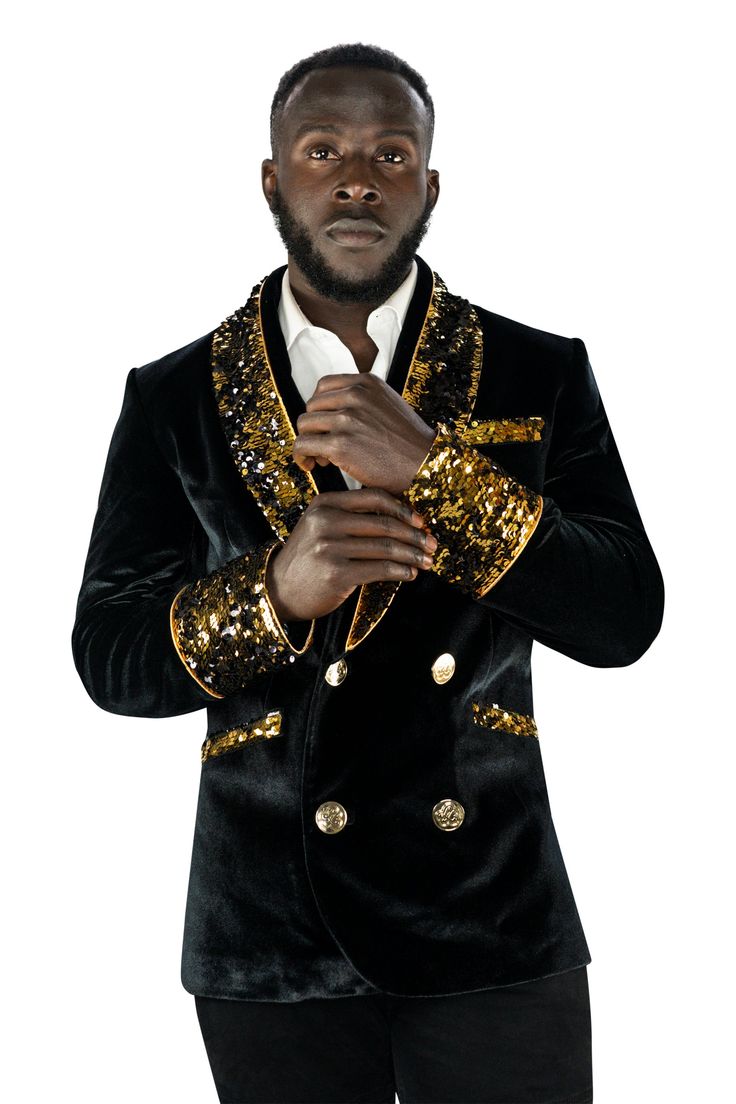 This mens velvet smoking jacket exudes a certain sophistication that other jackets can only dream of. We have taken this perfectly tailored, double breasted blazer to the next level with the addition of gold and black flip sequins. FEATURES: Double breasted Fully lined with satin 4 pockets including 1 inside breast pocket Reversible gold and black sequin contrast collar, cuffs and trim Velvet trimmed collar to for ultimate comfort Ethically made in-house in our studio & 100% carbon neutral Slim Gold Luxury Long Sleeve Blazer, Gold Party Blazer With Gold Buttons, Gold Blazer For Formal Winter Occasions, Gold Winter Blazer For Formal Occasions, Double-breasted Suits For Fall Party, Luxury Gold Suit For Party, Luxury Gold Blazer For Festive Season, Winter Velvet Blazer For Night Out, Luxury Velvet Outerwear For Party