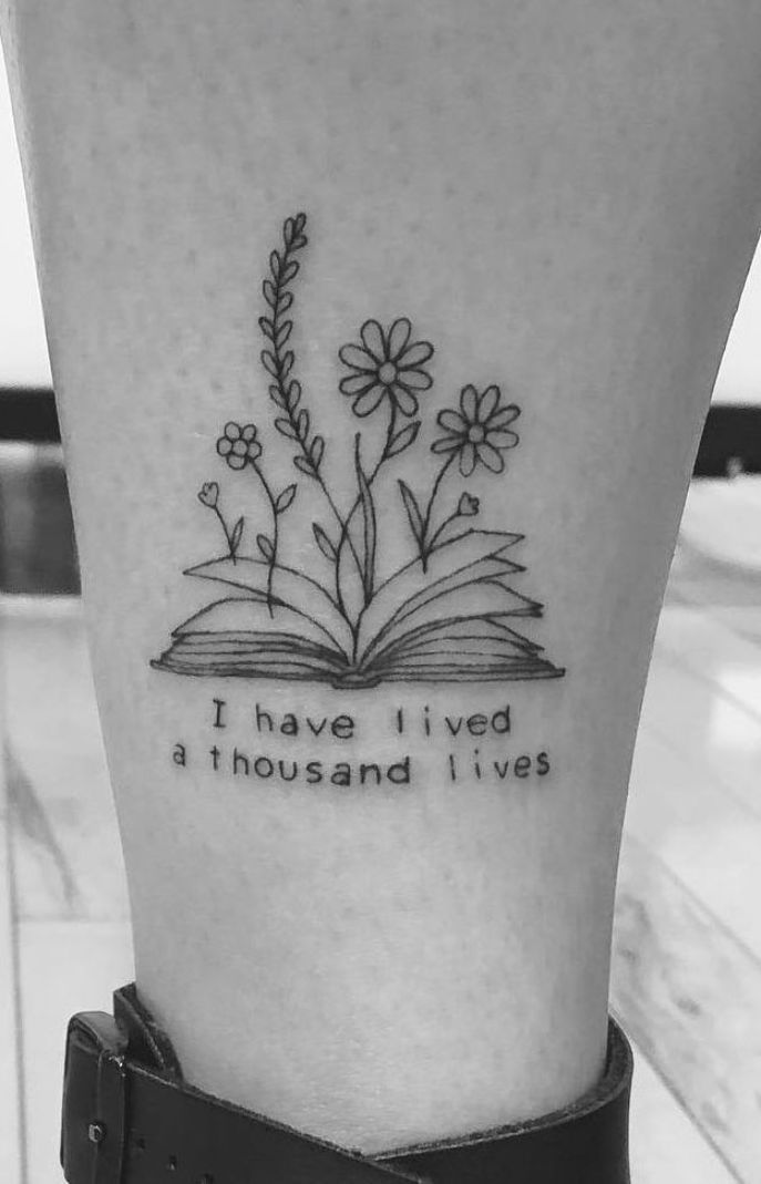 an open book with flowers and the words i have lived, a thousand lives