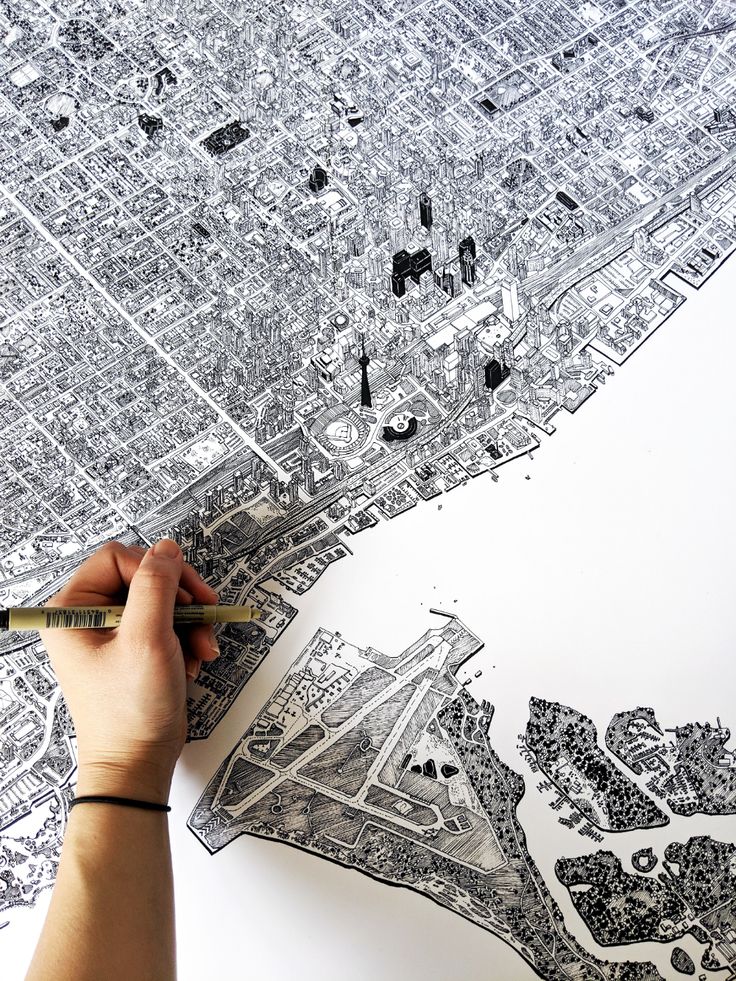 a person is drawing an aerial view of a city