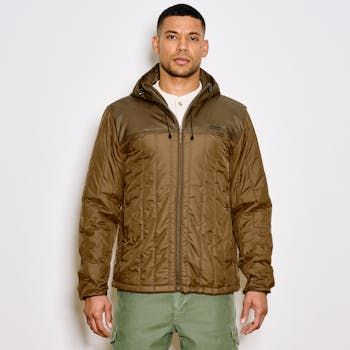 Made with a 1.5-oz. Cordura® ripstop nylon shell and insulated with 60g PrimaLoft® Gold, the Filson Ultra-Light Hooded Jacket is highly packable and surprisingly warm—made to be worn solo or as an insulating mid-layer in colder temperatures. Because PrimaLoft® Gold retains 98% of its warmth when wet, it boasts unmatched versatility in any weather. The full-length zipper has a zipper garage, so it’s comfortable when zipped all the way to the chin. The elastic cuffs and drawcord-adjustable hood and hem ensure a snug fit that seals in warmth, and zippered, Moleskin-lined handwarmer pockets add even more warmth and comfort. Features an interior zippered security pocket and a double layer of fabric over the yoke for durability. | Filson Ultralight Hooded Jacket GldOchrBch Size XS Outdoor Nylon Puffer Parka, Quilted Nylon Parka For Outdoor, Outdoor Quilted Nylon Parka, Outdoor Nylon Windbreaker With Fleece Lining, Brown Hooded Nylon Puffer Jacket, Nylon Puffer Hooded Jacket For Outdoor Activities, Insulated Long Sleeve Windbreaker For Outdoor, Insulated Long Sleeve Hooded Jacket For Outdoor, Nylon Quilted Puffer Jacket For Outdoor Activities