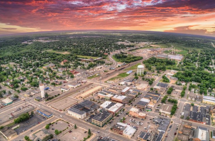 an aerial view of a city at sunset