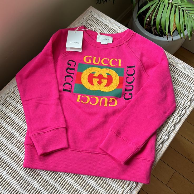 Authentic Unisex Gucci Logo Toddler Pullover Sweatshirt. Made In Italy . New With Tags. Trendy Long-sleeve Tops With Logo Detail, Trendy Long Sleeve Tops With Logo Detail, Gucci Crew Neck Top With Ribbed Cuffs, Gucci Cotton Sweatshirt With Logo, Casual Gucci Sweatshirt With Embroidered Logo, Gucci Embroidered Logo Long Sleeve Sweatshirt, Pink Cotton Top With Logo Detail, Gucci Long Sleeve Tops With Embroidered Logo, Gucci Cotton Sweatshirt With Ribbed Cuffs