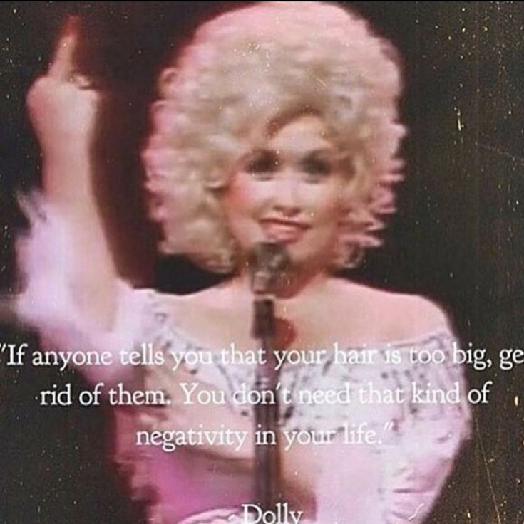 dolly monroe on stage with her hand up in the air and an old quote above it