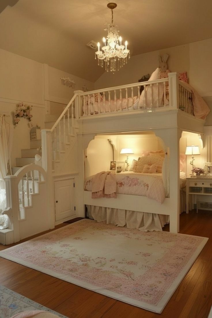 a white bunk bed sitting in the middle of a room next to a chandelier