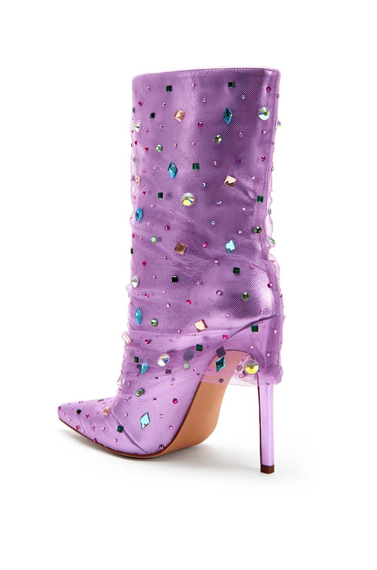 **FINAL SALE - NO EXCHANGES OR RETURNS** All the glam and luxury you would ever want out of a heeled boot! The Liora Stiletto Boot in Lilac Purple features a metallic, shiny base with a pointed toe silhouette. There is a tulle overlay on the boot and multicolored chunky rhinestones scattered all over the shoe. These are perfect for adding a pop of color to any elevated outfit! Glamorous Knee-high Spring Boots, Glamorous High Ankle Boots For Party, Trendy Heeled Boots For Party With Reinforced Heel, Trendy Heeled Boots With Reinforced Heel For Party, Glamorous Knee-high Boots For Party, Winter Party Platform Boots With Pointed Toe, Trendy Pointed Toe Boots For Party Season, High Heel Knee-high Boots With Rhinestones For Party, Trendy Pointed Toe Party Boots