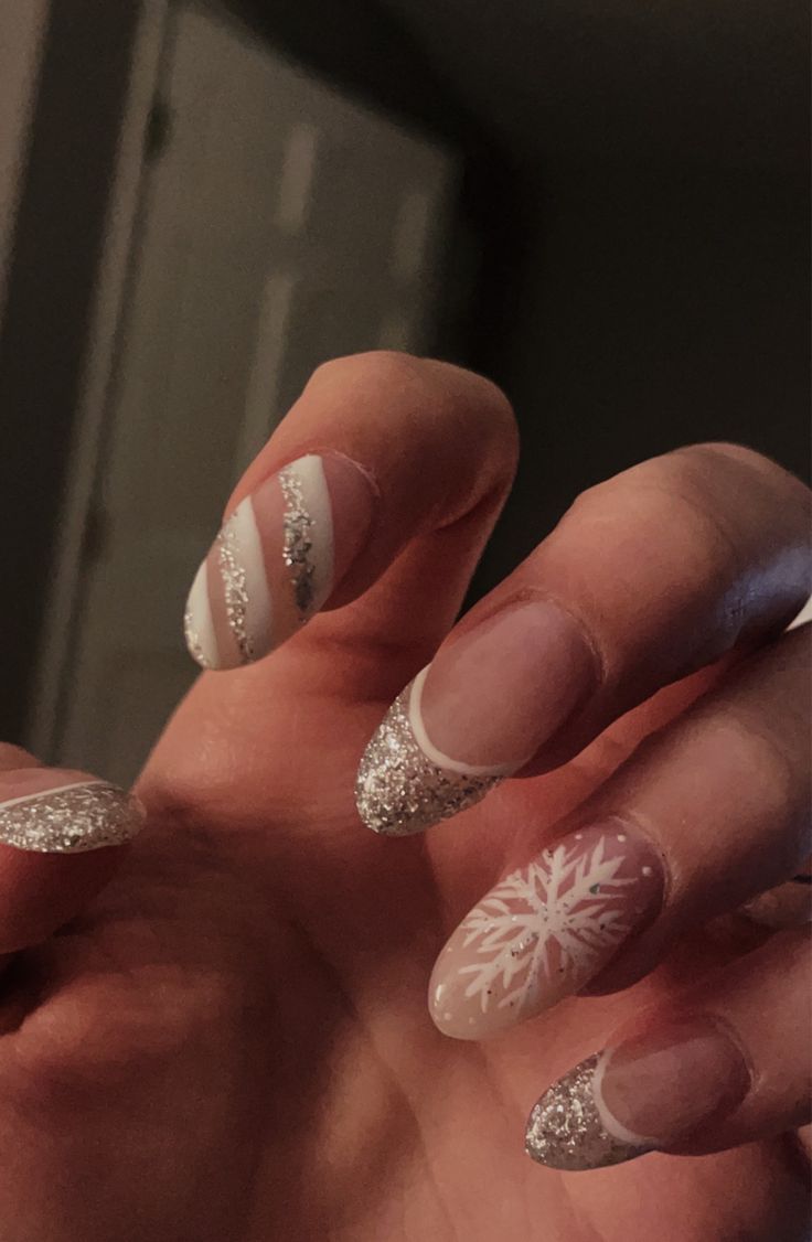 Winter Christmas New Years nails snowflake white and silver glitter nails Nails White And Silver Glitter, Silver And White Christmas Nails, Almond Snowflake Nails, White And Silver Christmas Nails, White Diamond Nails, New Years Nails, Silver Glitter Nails, Nails White, Snowflake Nails