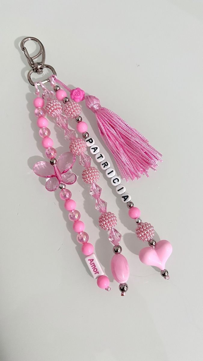 a key chain with pink beads and tassels