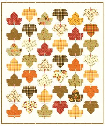 an autumn quilt with leaves on it