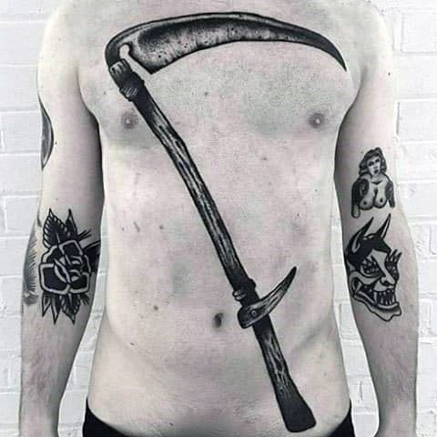 a man with a tattoo on his chest holding a knife