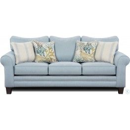 a blue couch with two pillows on it