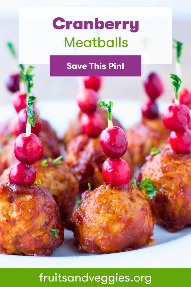 cranberry meatballs on a white plate with text overlay that reads, cranberry meatballs save this pin