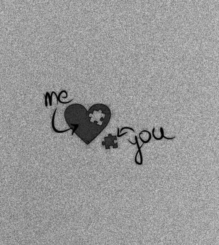 the word i love you written in black ink on a gray background with a heart and puzzle piece