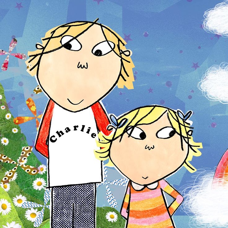 a child and an adult standing in front of a christmas tree with flowers on it