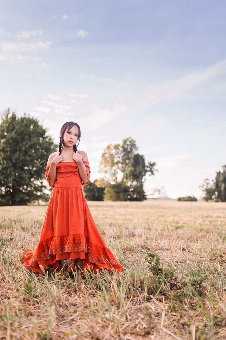 "THE ISLA DRESS The Isla dress is a vintage inspired dress with bohemian flair.  The bold copper orange color reminds us of autumn leaves and golden sunsets. This flowy dress epitomizes the effortless allure of bohemian style and delivers laid back elegance in an easy to wear off the shoulder fit. This dress is also available in women's sizes so you can match with your little ones!  Women's dresses sold separately. Click here to shop the women's dress:  https://www.etsy.com/listing/854786590/vel Flowy Photoshoot, Girls High Low Dress, High Low Lace Dress, Rustic Flower Girl, Bohemian Kids, Rust Color Dress, Rustic Flower Girl Dress, Maxi Dress Boho Chic, Toddler Girl Fall