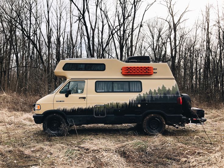 an rv parked in the middle of a field