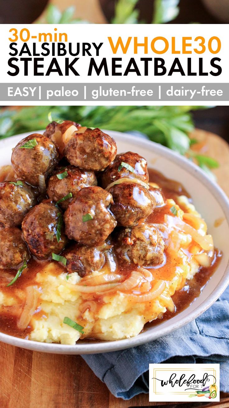 a white plate topped with meatballs covered in gravy