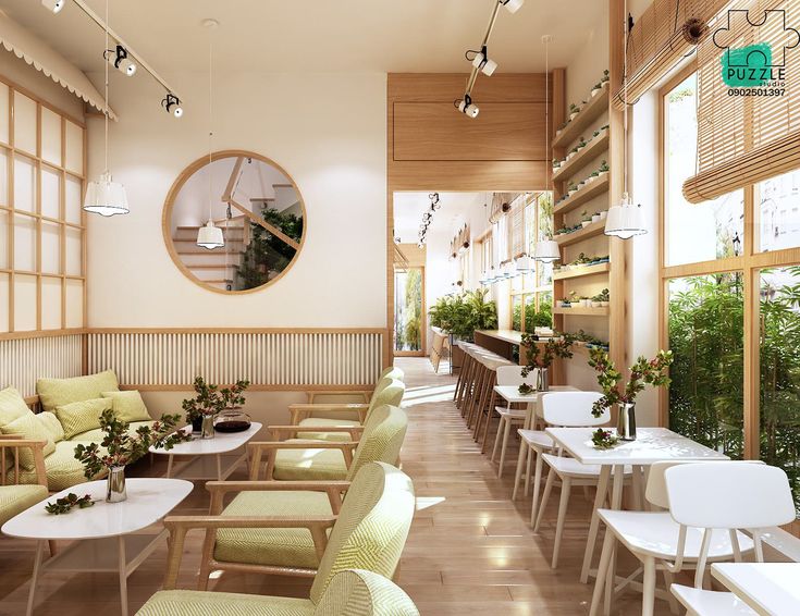 the interior of a restaurant with tables, chairs and plants on display in front of large windows