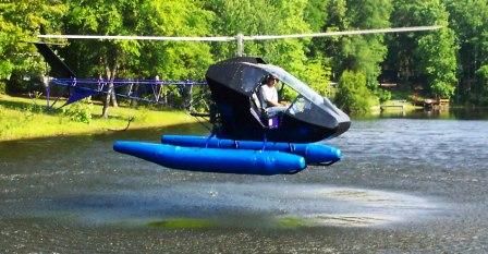 a man riding on the back of an inflatable boat over a body of water