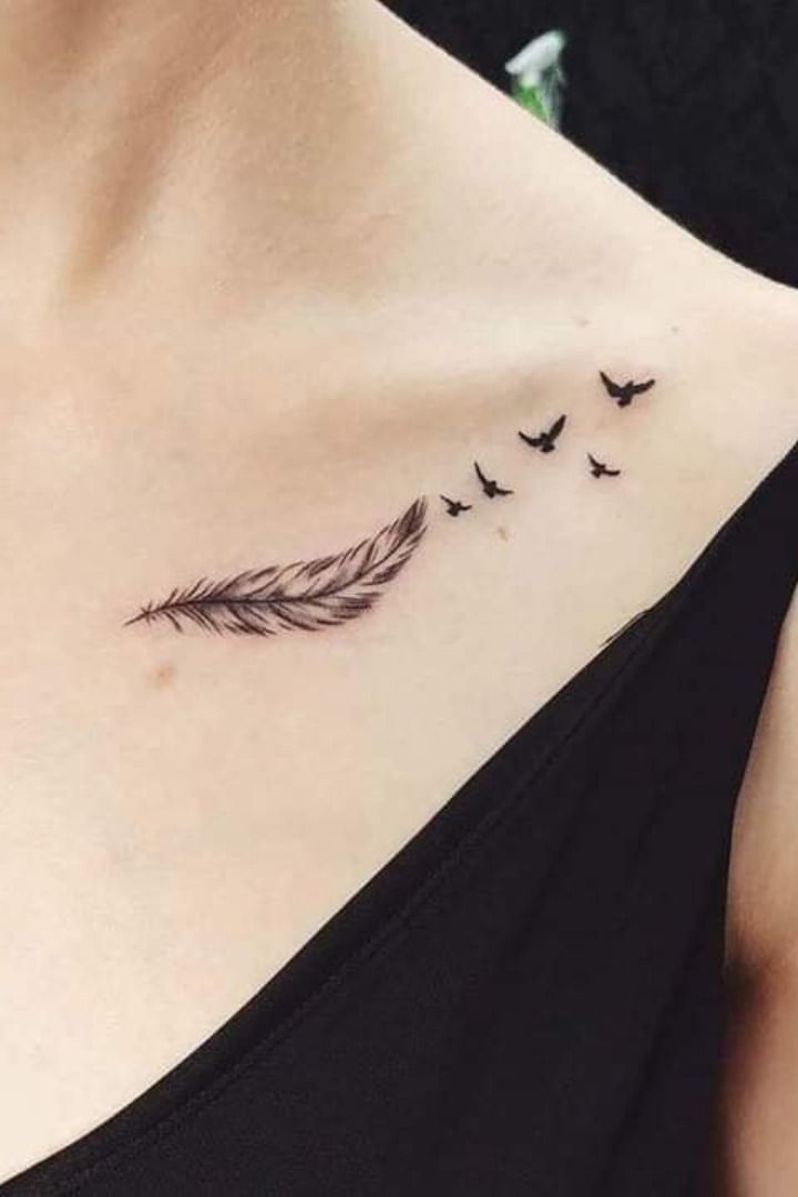 a woman's chest with birds flying around it