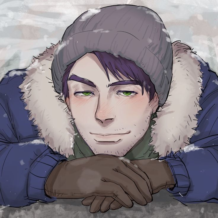 a man with green eyes wearing a winter hat and gloves is looking at the camera