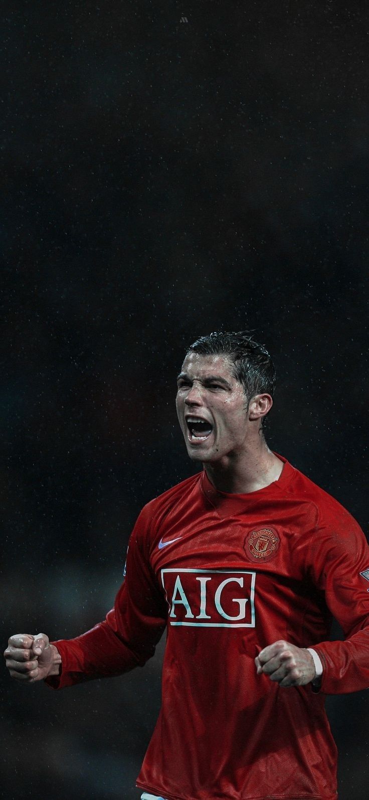 a soccer player with his mouth open in the rain