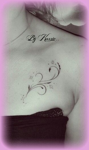 a woman with a tattoo on her chest saying, be present to the world by herself