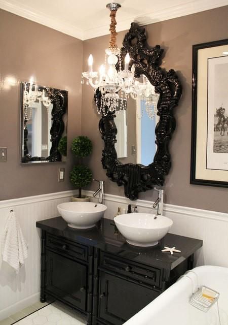 a bathroom with two sinks and a large mirror above the sink in front of it