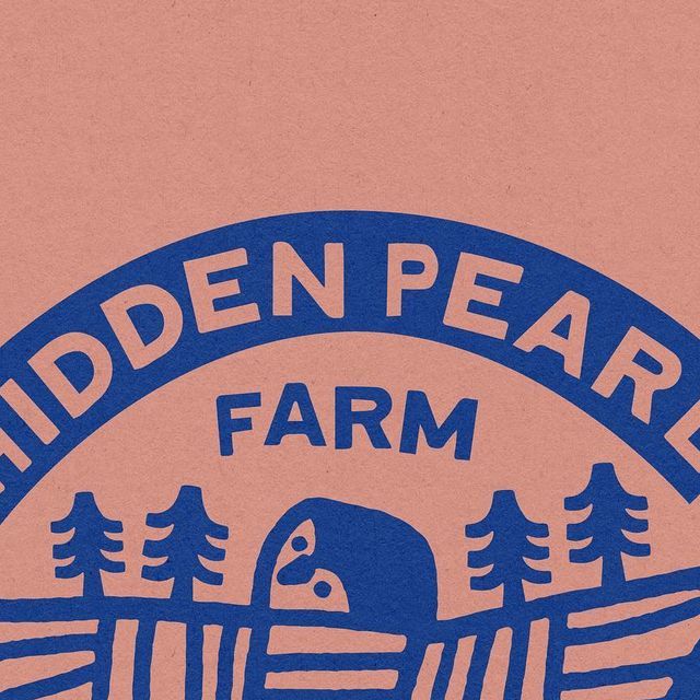 a blue and pink sign that says hidden pear farm