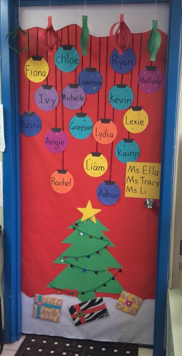 a door decorated with christmas tree and name tags